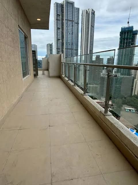 Indiabulls Sky Forest: A private terrace with a glass railing