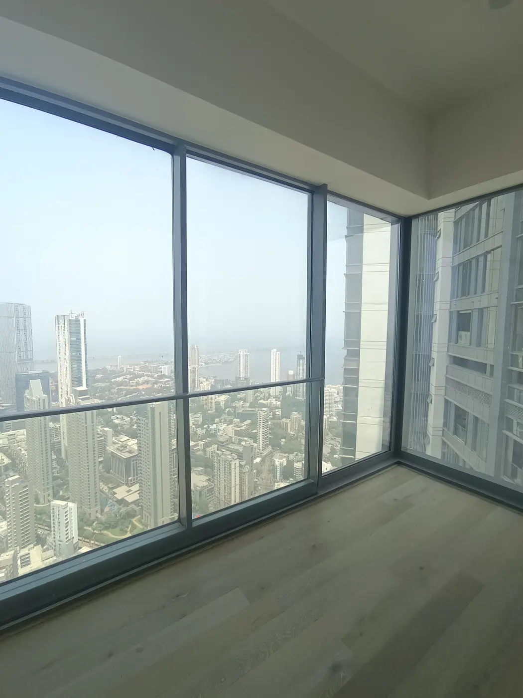 Rustomjee Crown: Corner glazing on a high floor